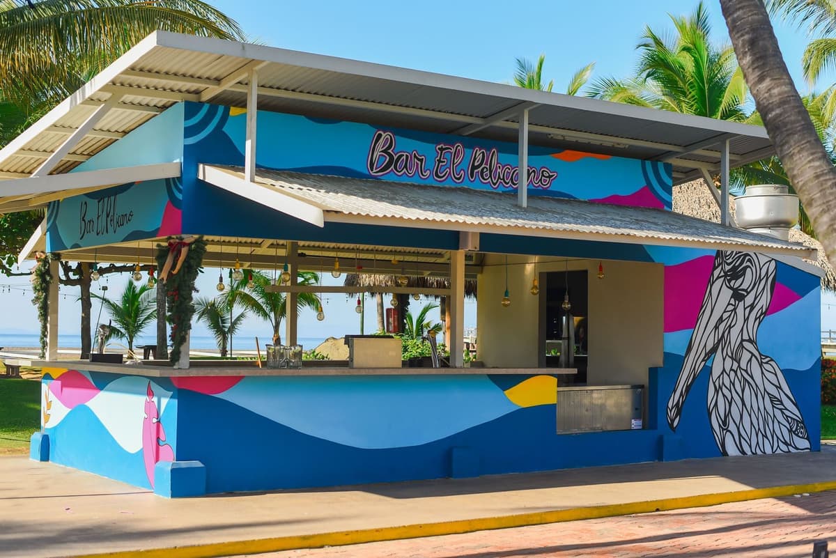 Resort bar area with tropical cocktails and evening entertainment atmosphere
