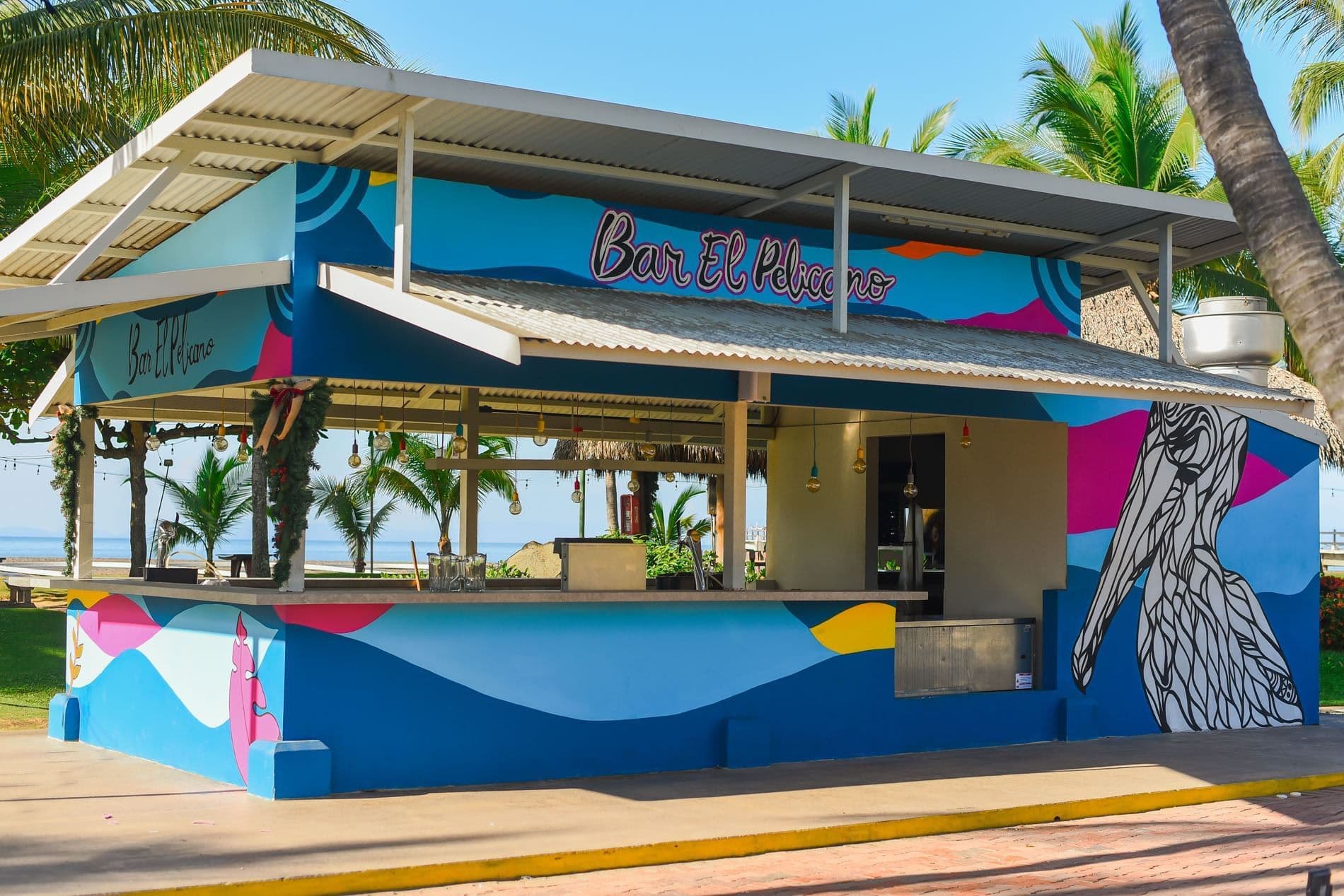 Resort bar area with tropical cocktails and evening entertainment atmosphere