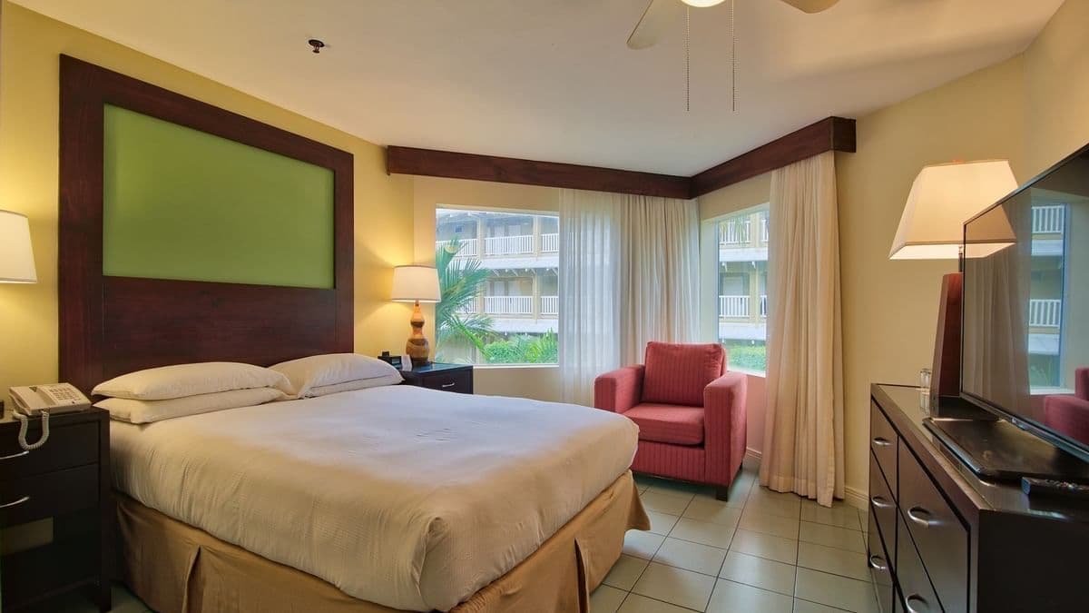 Junior Suite Garden View with king bed master bedroom and separate living room