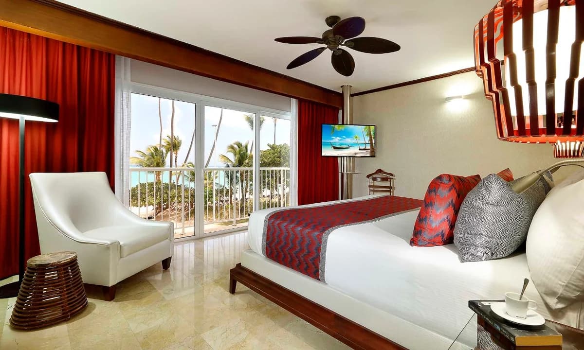 Ambassador Suite Panoramic Ocean View with spacious living area, premium furnishings, and Caribbean views