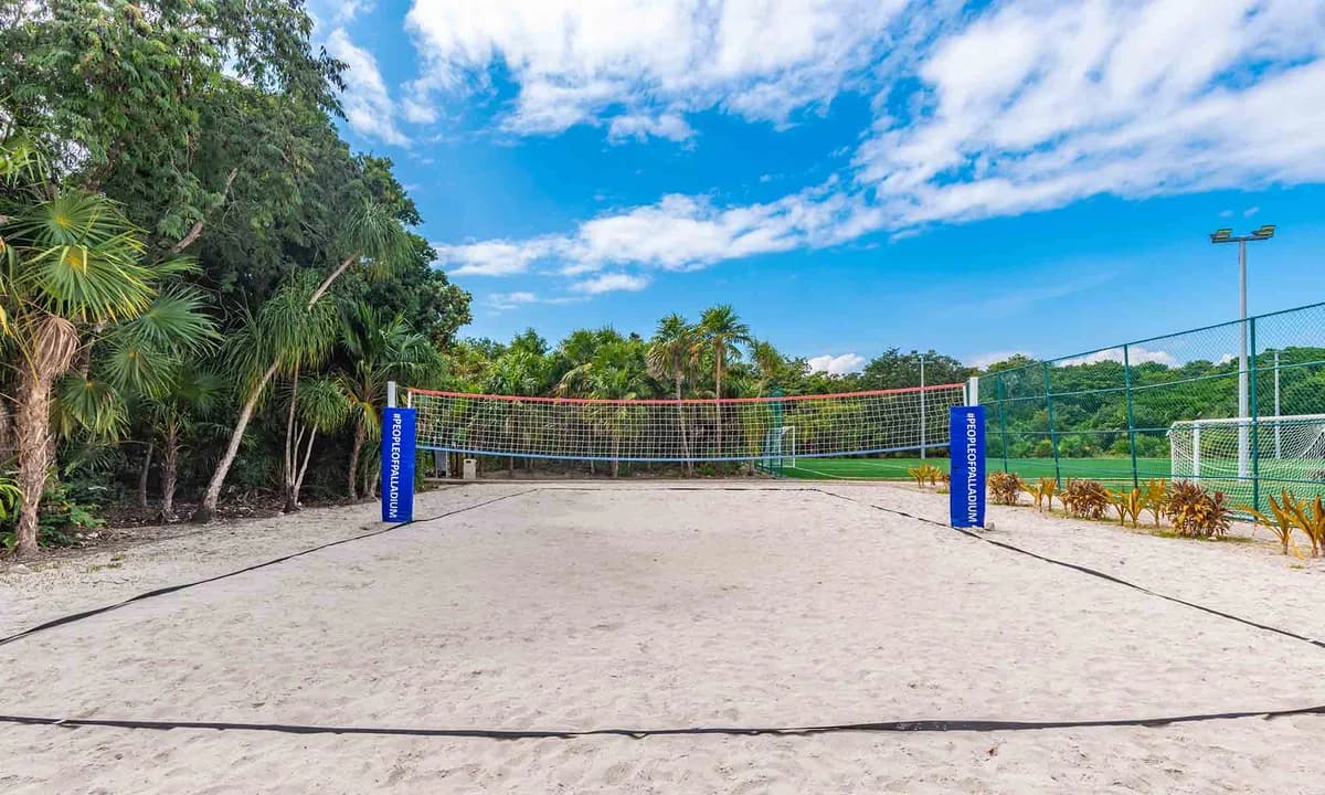 Sports facilities including tennis, padel, volleyball, and archery within the Riviera Maya complex