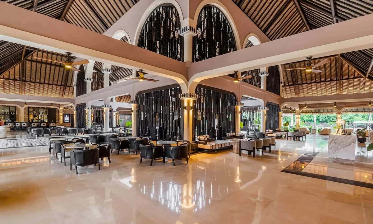 Grand Palladium Colonial lobby with elegant Spanish colonial design, vaulted ceilings, and tropical decor