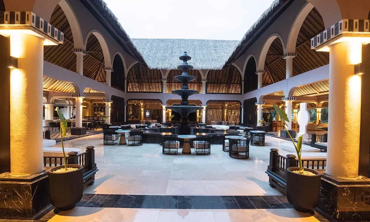 Colonial lobby seating area with traditional Mexican touches and warm lighting