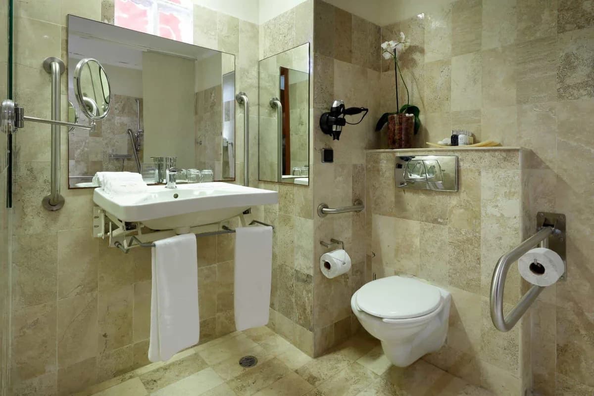 Deluxe Garden View room bathroom with modern fixtures and marble finishes