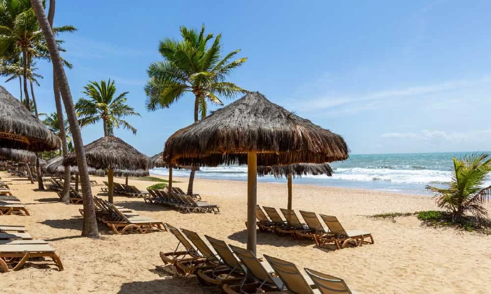 Imbassai Beach with golden sand where the Imbassai River meets the Atlantic Ocean