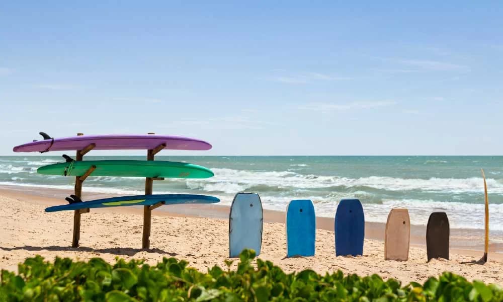 Atlantic Ocean beachfront at Grand Palladium Imbassai with loungers and palm-fringed coastline