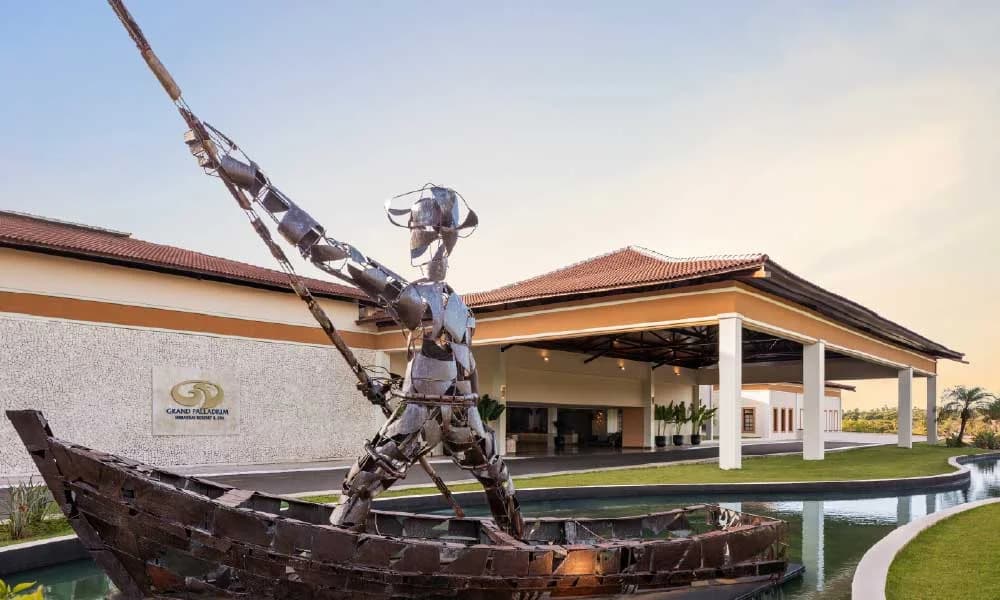 Lobby seating area with tropical-inspired furnishings and warm lighting
