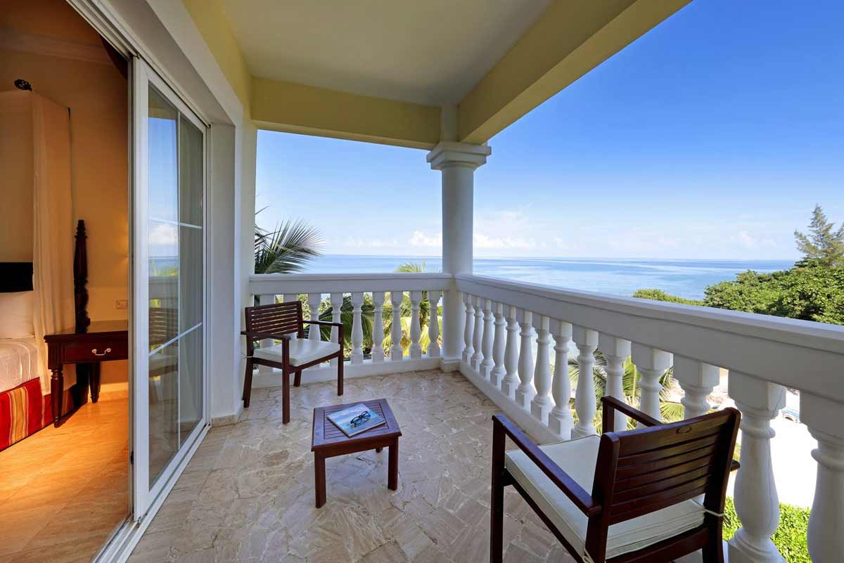 Main swimming pool at Grand Palladium Jamaica featuring the 86,000-square-foot pool complex with swim-up bar, whirlpools, and tropical landscaping