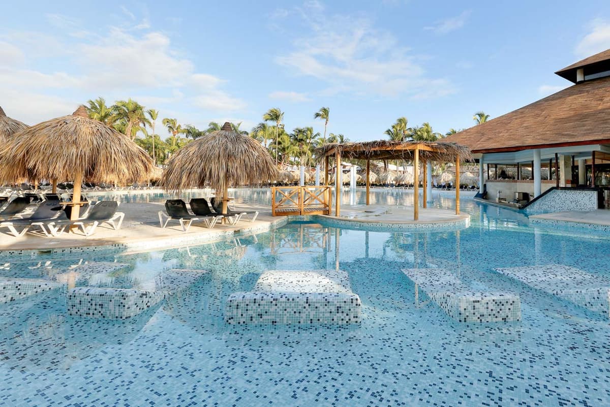 Beachfront loungers and palm trees on Bavaro Beach