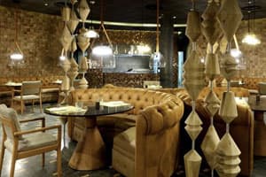 El Dorado steakhouse featuring charcoal-grilled meats in a refined dining setting with spectacular views