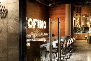 Portofino Italian restaurant with elegant dining room, exposed kitchen, and Mediterranean-inspired decor