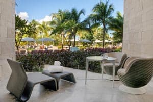 Junior Suite Pool Access with direct step-out terrace to the pool, hammock, and modern suite amenities