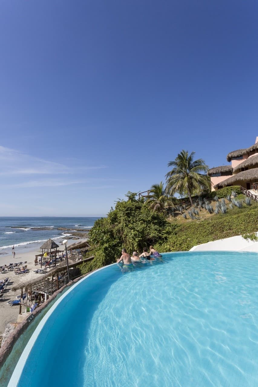 Adults-only heated infinity pool overlooking the Pacific Ocean