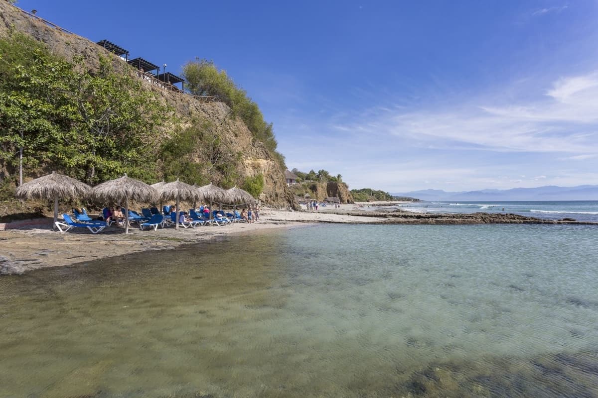 Natural saltwater pool surrounded by tropical gardens — the largest pool on property at 3,000 square meters