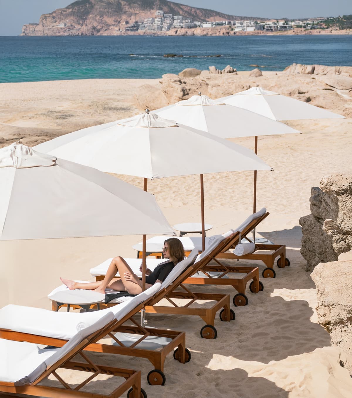 Private beach on the Sea of Cortez with Balinese beds and dramatic rock formations