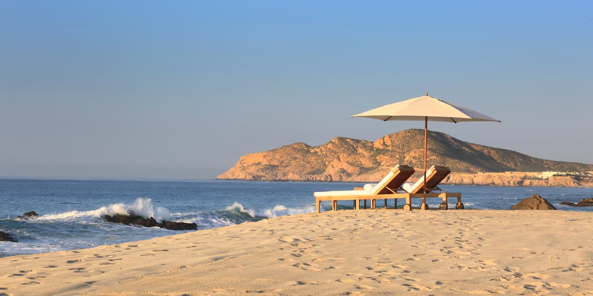 Beachfront lounging area with Baja California coastline views