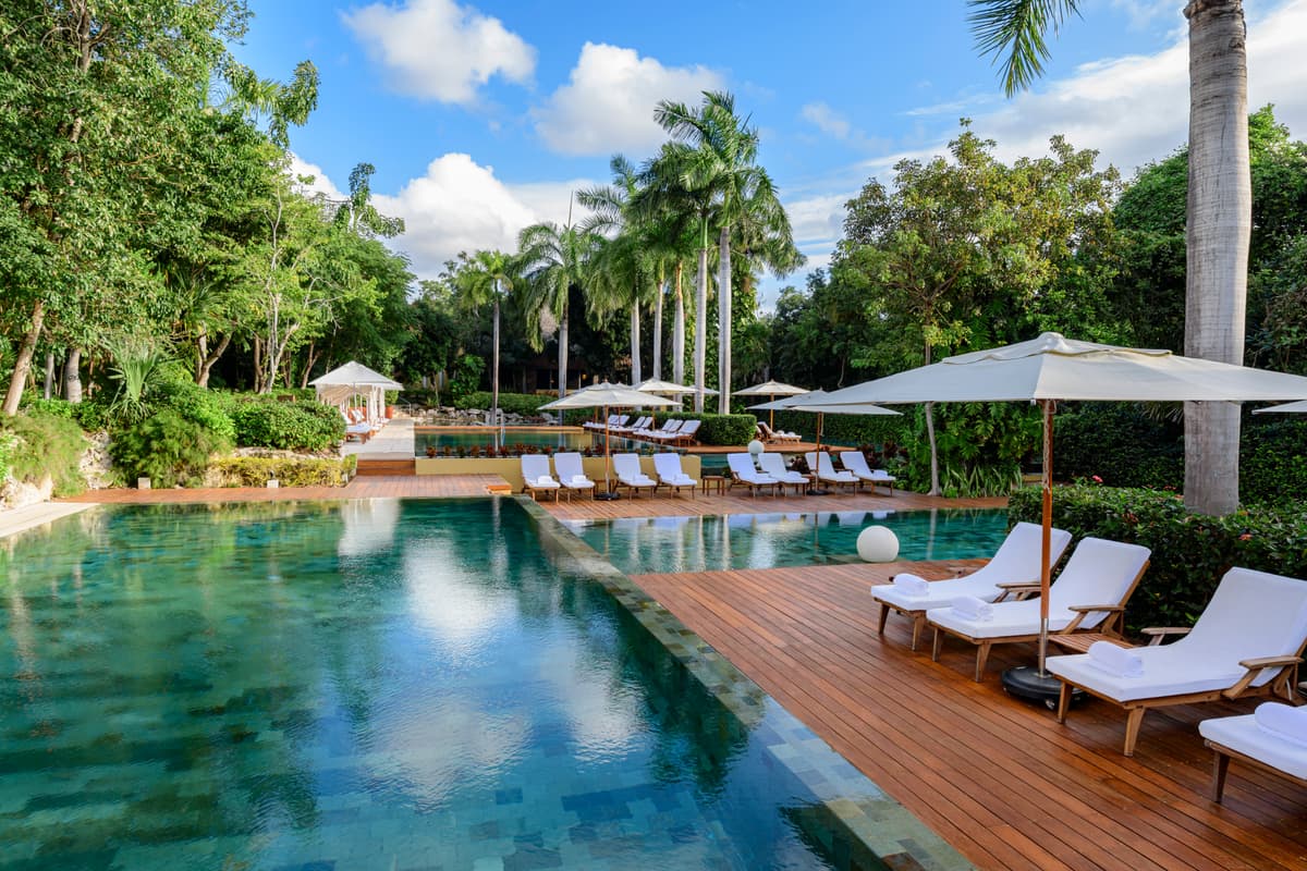 Zen Grand multi-tiered infinity pool surrounded by Mayan jungle