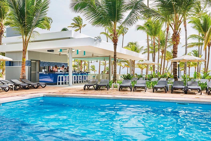 Swimming pool area at Hotel Riu Bambu