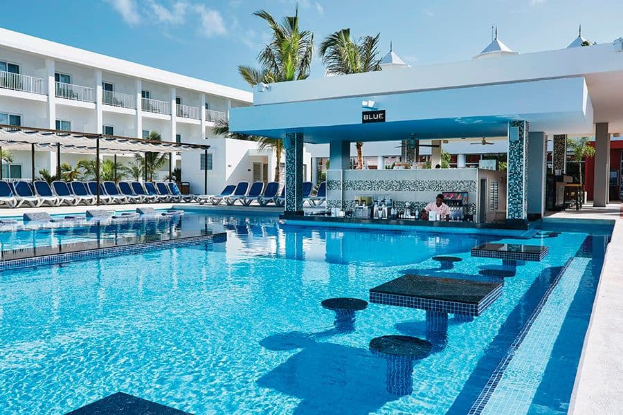 Swimming pool area at Hotel Riu Bambu