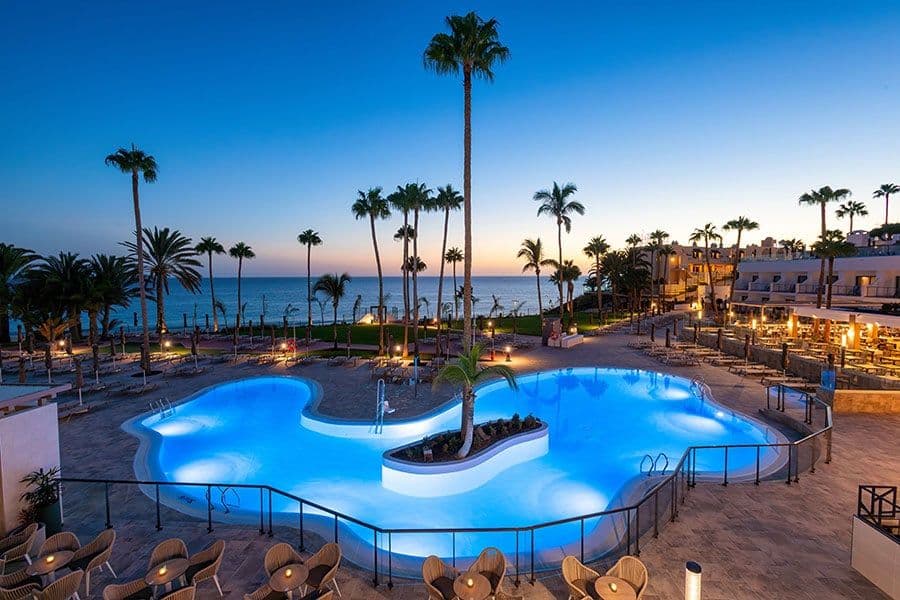 Swimming pool area at Hotel Riu Calypso
