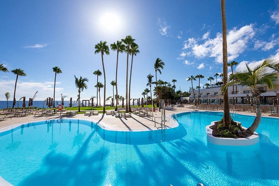 Swimming pool area at Hotel Riu Calypso