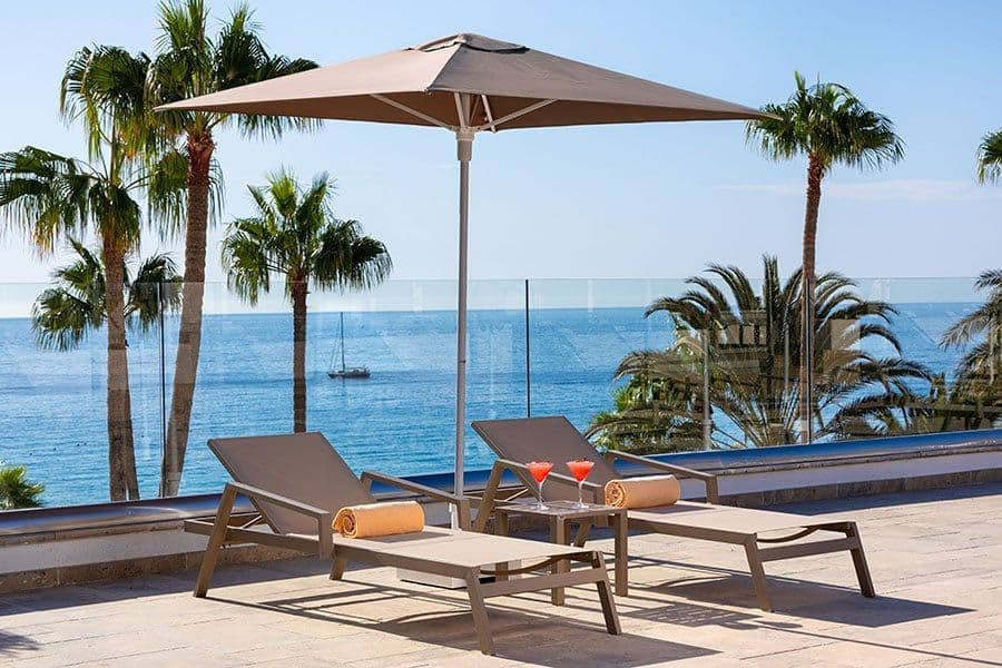 Swimming pool area at Hotel Riu Calypso
