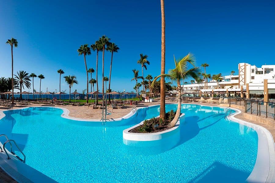 Swimming pool area at Hotel Riu Calypso