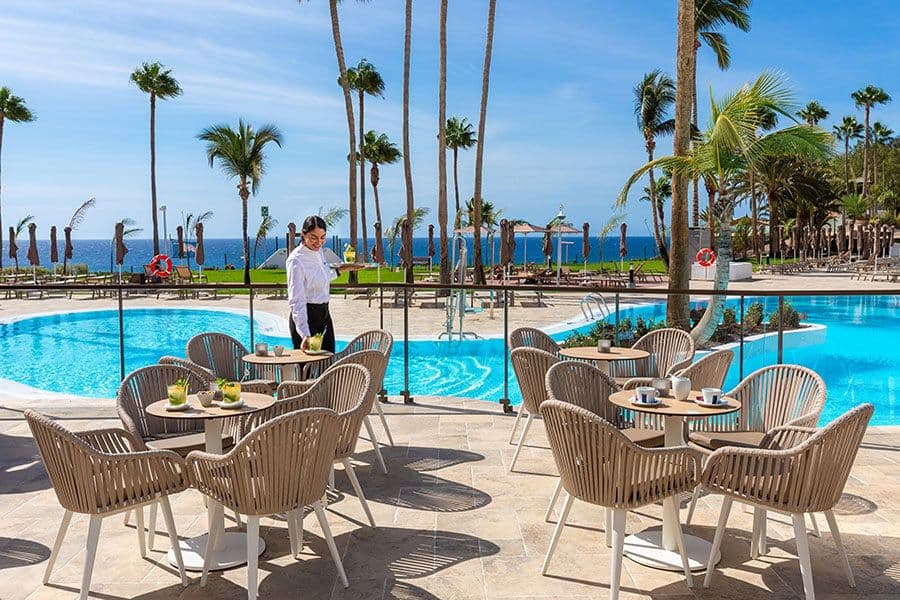 Swimming pool area at Hotel Riu Calypso