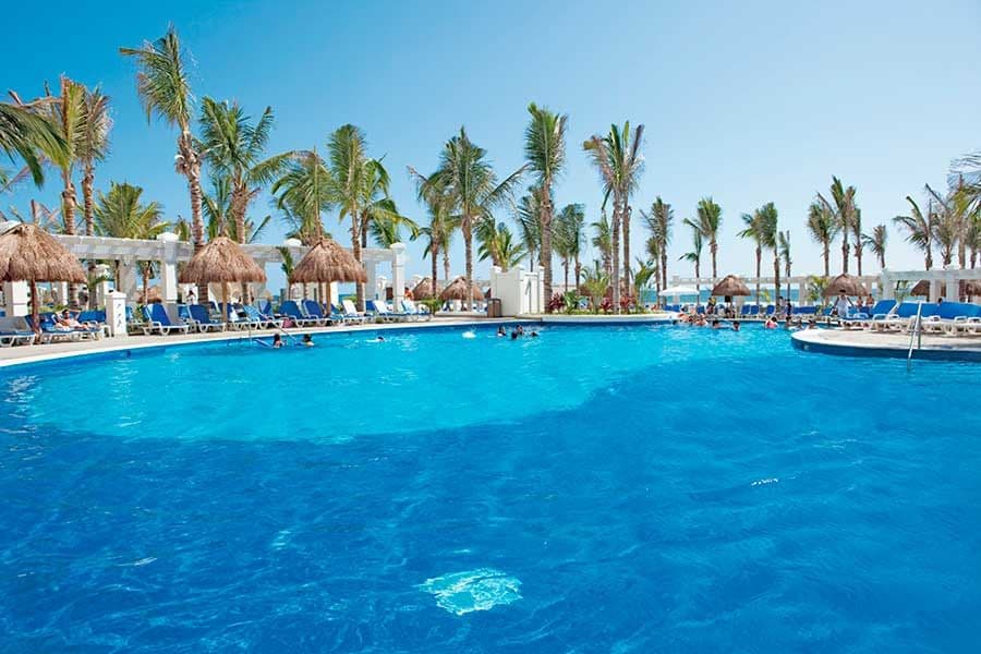 Swimming pool area at Hotel Riu Emerald Bay