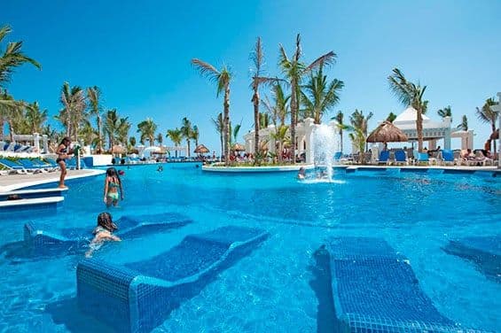 Swimming pool area at Hotel Riu Emerald Bay