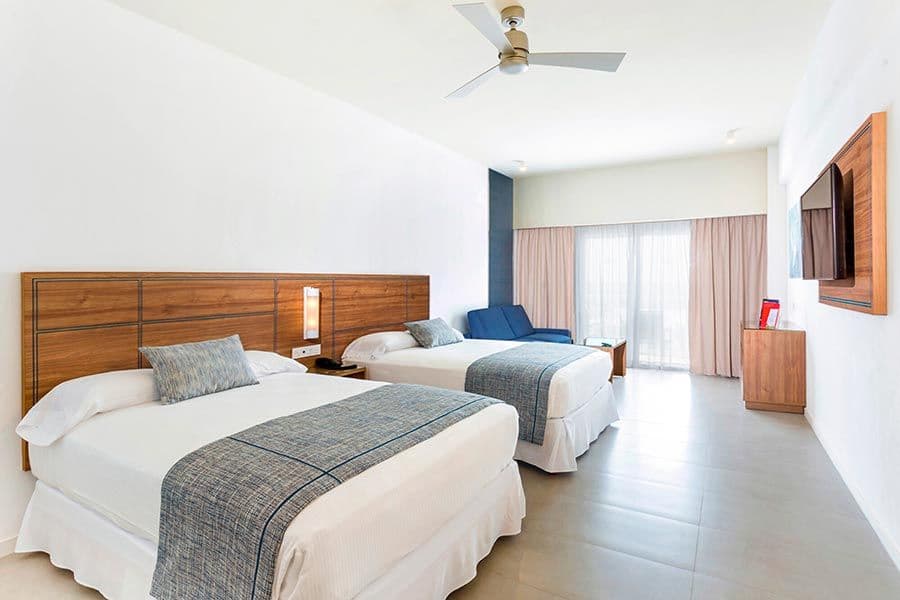 Guest room at Hotel Riu Emerald Bay