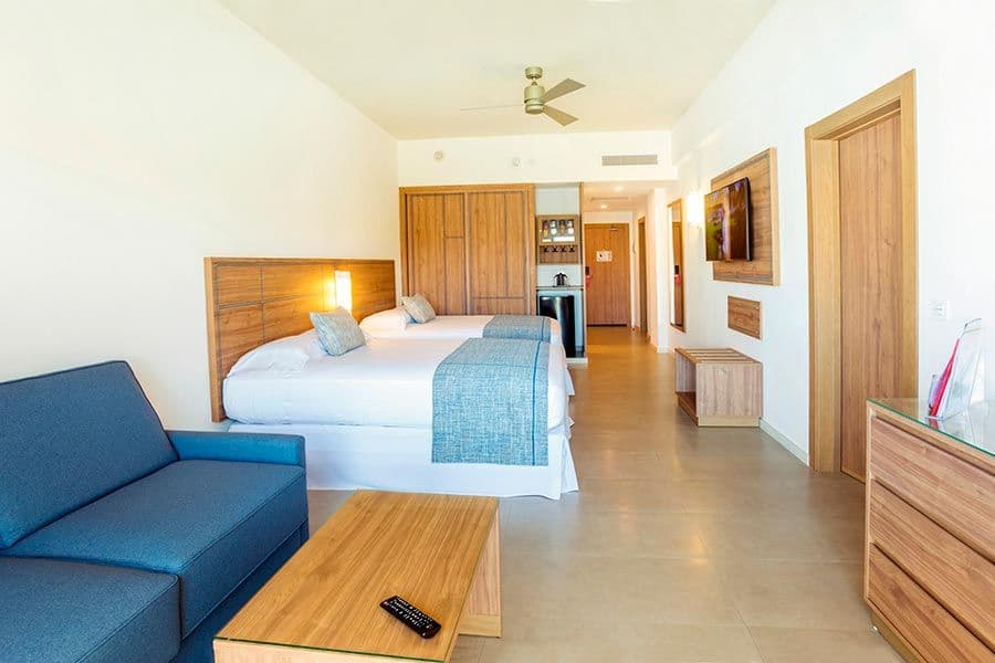 Guest room at Hotel Riu Emerald Bay