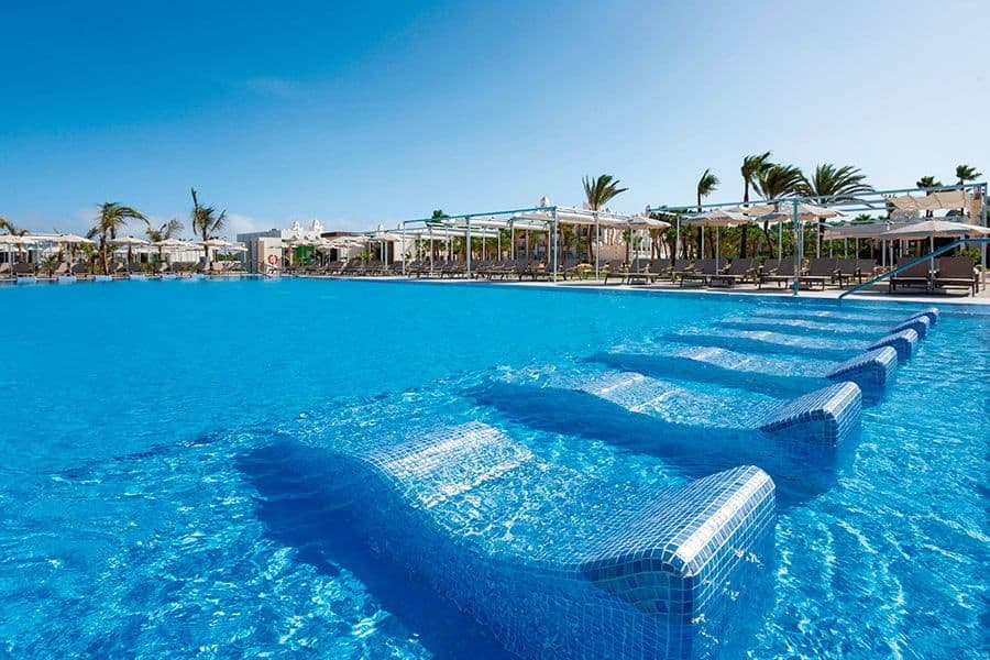 Swimming pool area at Hotel Riu Karamboa