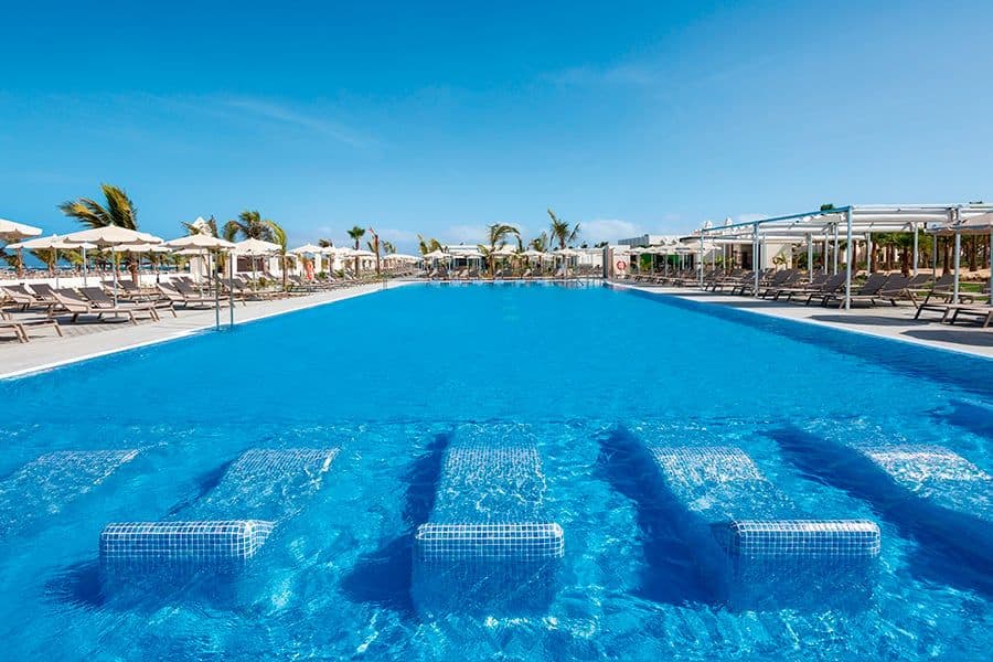 Swimming pool area at Hotel Riu Karamboa
