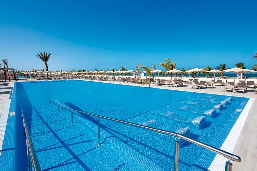 Swimming pool area at Hotel Riu Karamboa