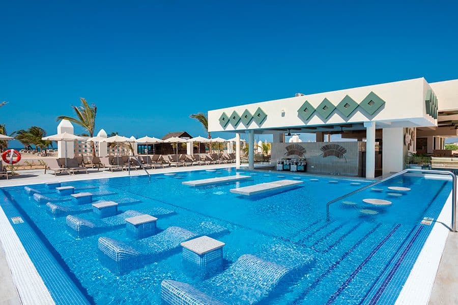 Swimming pool area at Hotel Riu Karamboa