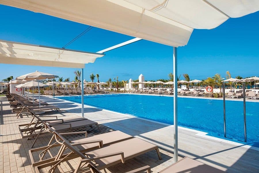 Swimming pool area at Hotel Riu Karamboa