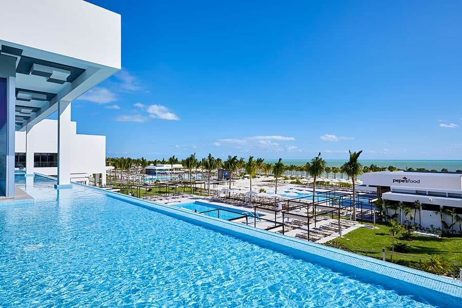 Swimming pool area at Hotel Riu Palace Costa Mujeres