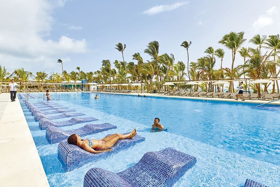 Swimming pool area at Hotel Riu Palace Punta Cana