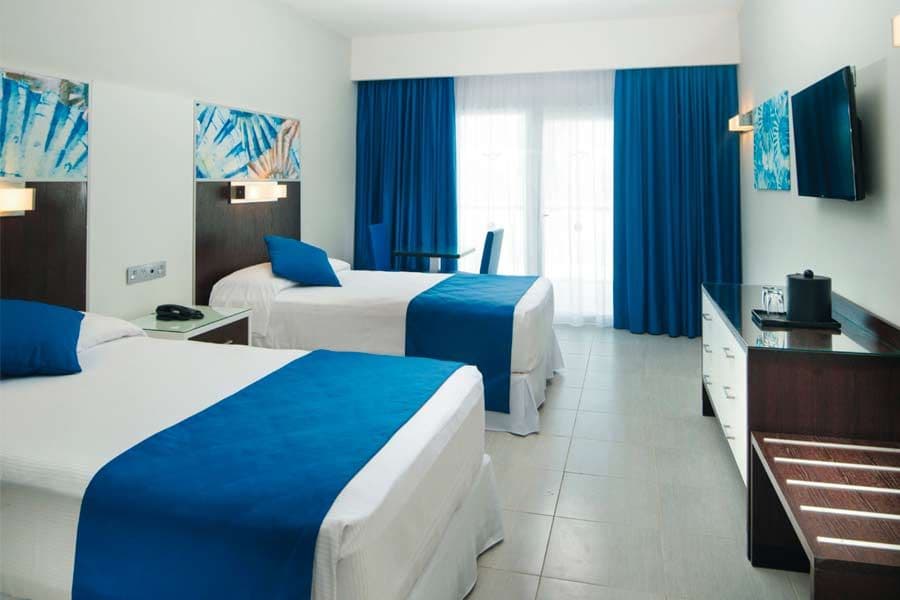 Guest room at Hotel Riu Reggae
