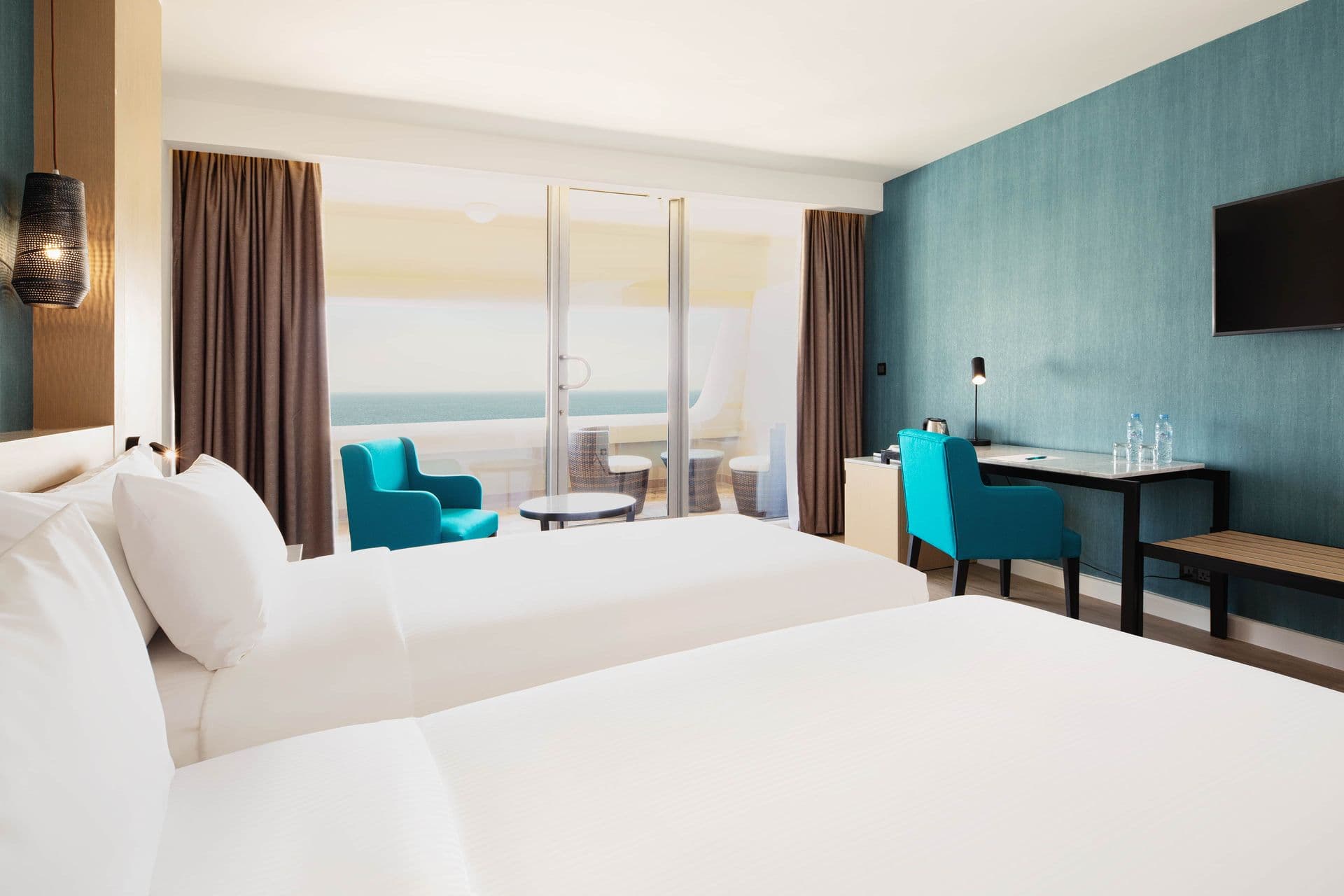 Guest room at Occidental Sharjah Grand