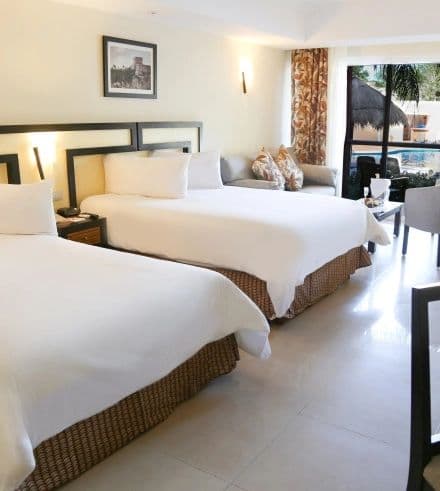 Guest room at Sandos Playacar All Inclusive