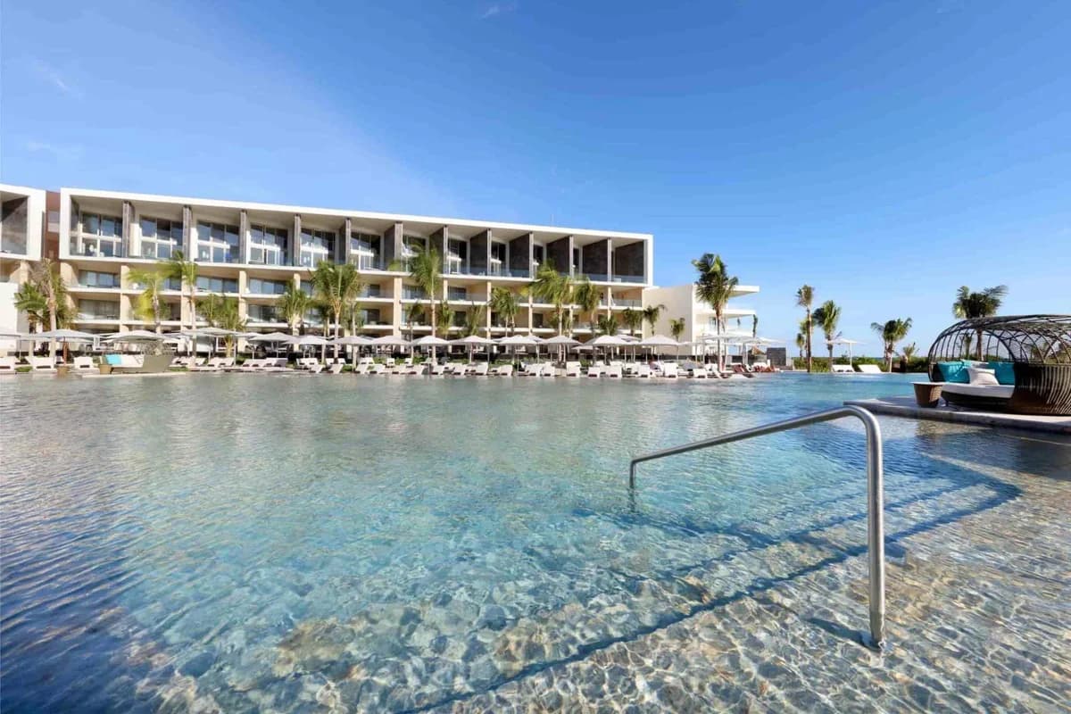 Infinity-edge pool at TRS Coral Hotel overlooking the Costa Mujeres beachfront