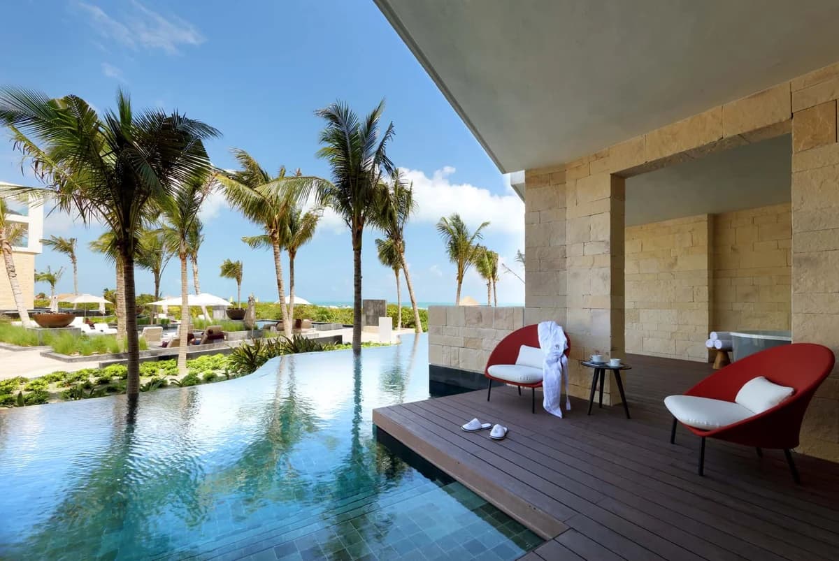 Ambassador Suite Swim-up with beachfront ocean view and direct pool access from the terrace