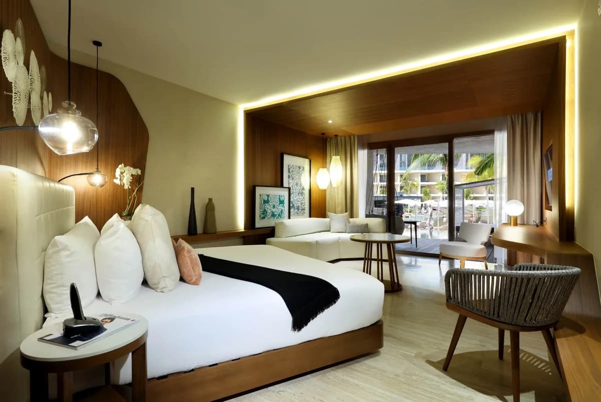Junior Suite Swim-up with beachfront ocean view, king bed, and premium amenities