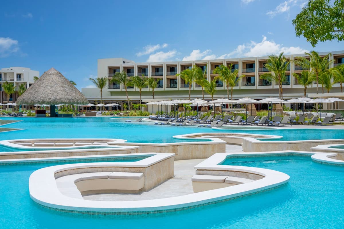 Pool lounges and cabanas at Zemi Miches