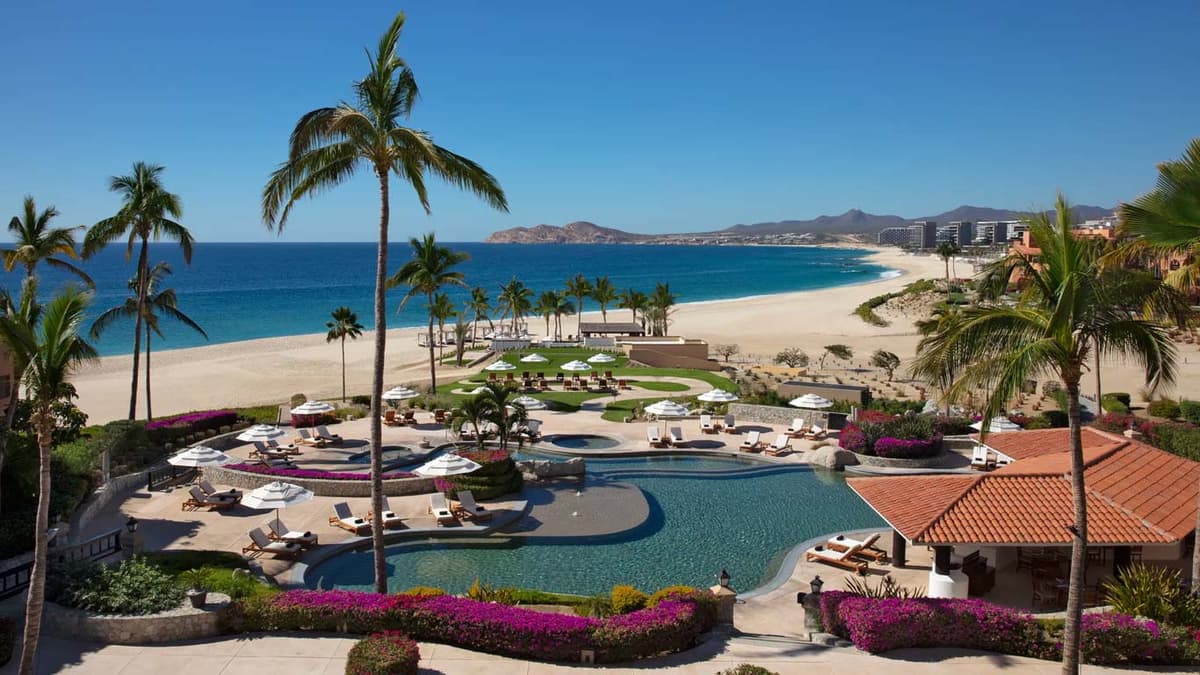 Spanish-colonial architecture with arched doorways and ocean views along the Tourist Corridor