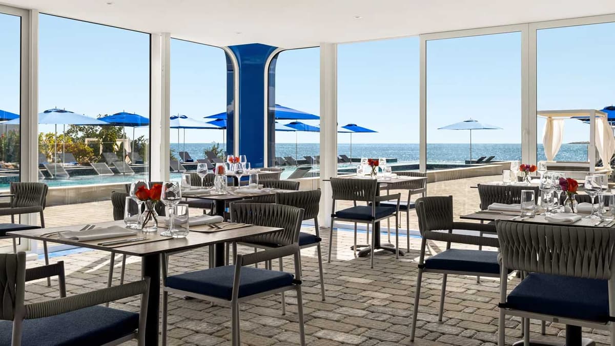 Battellino restaurant at Il Mare Beach Club with ocean views through floor-to-ceiling windows