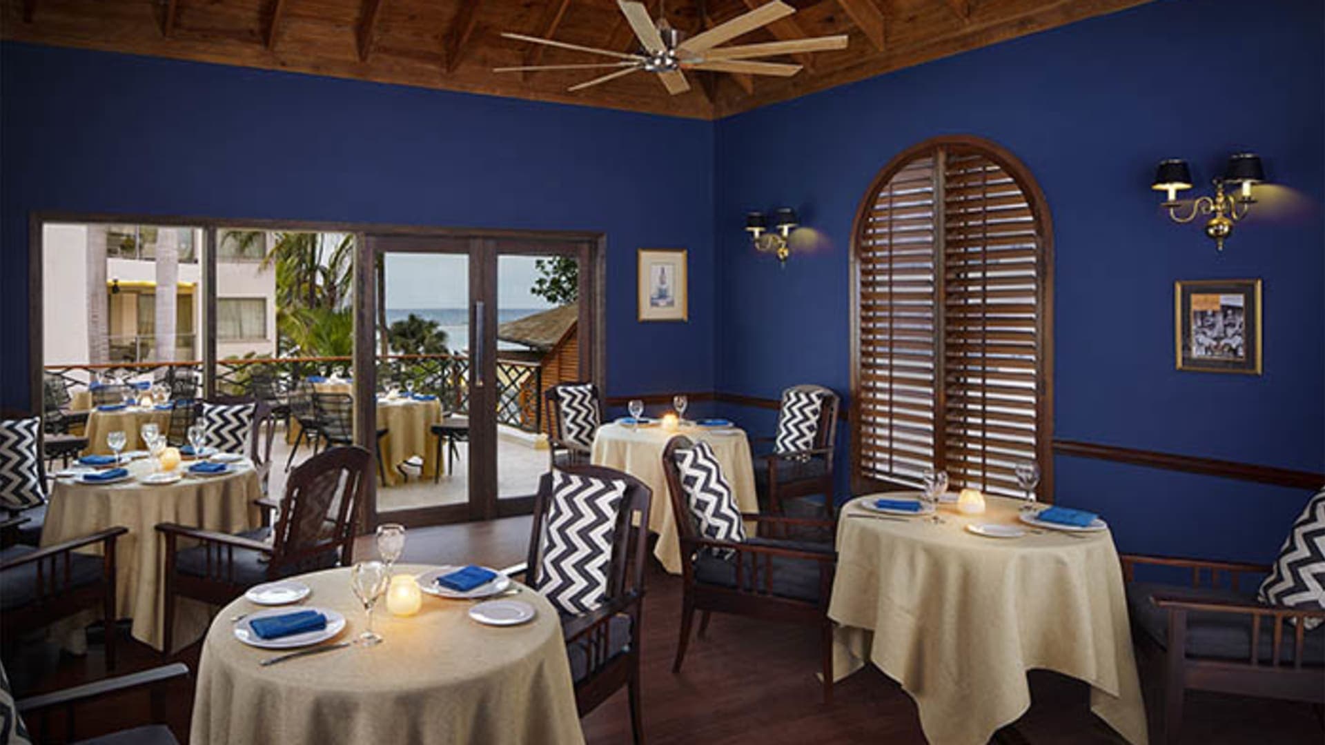 Elegant indoor restaurant at Zoetry Montego Bay with candlelit tables