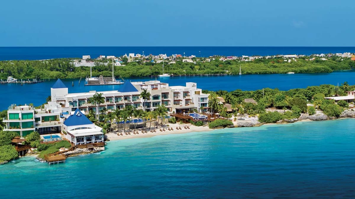 Aerial view of Zoetry Villa Rolandi showing the resort between the Caribbean Sea and Isla Mujeres lagoon